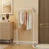 Nuevo perchero de pie con ruedas para almacenamiento en el dormitorio, perchero simple para la sala de estar, colgador de ropa para el hogar