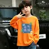 Camiseta casual para crianças mais velhas, top versátil, estilo celebridade da internet da moda, novo modelo primavera/outono, design de desenho animado legal e estiloso, manga longa de algodão puro para meninos