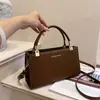 Bolsa de maternidad de alta gama, diseñada para mujeres de mediana edad, con un estilo simple y elegante, una marca popular y una gran capacidad, lo que la convierte en un regalo perfecto para el uso diario.