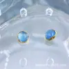 Pendientes de Aleación de Titanio Astmf-136 Color Dorado Borde Ondulado Piedra Ojo de Gato Fotosensible Joyería para Piercing de Titanio G23 Cabeza