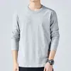 Camiseta masculina de manga comprida para primavera e outono, estilo coreano, corte justo, cor sólida, gola redonda, top de base, moderno