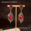 Palacio de Moda Europeo y Americano Vintage Retro Elegante Piedra de Color Circonita Pluma Metal Pesado Aretes de Presión