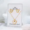 Pendientes franceses y conjunto de colgante de mariposa de acero inoxidable nacarado transfronterizos europeos y americanos, joyería al por mayor directamente del fabricante