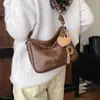 Bolso Retro para Mujer Bolso de Mano Colgante Nicho Viaje Diario Bolso de Hombro Simple Debajo del Brazo Moda Otoño Invierno 2026 Nuevo Versátil