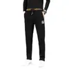 Pantalones de pana para hombre con forro polar, nuevos para otoño e invierno, venta al por mayor, bordados de China, pantalones casuales, versátiles, holgados, casuales