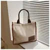 Lona Casual e Moderna 2025 Nova Saco Lateral Casual Estilo Literário Coreano de Grande Capacidade Roupa de Trabalho Simples Bolsa Tote de Ombro
