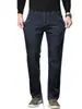 Nuevos pantalones vaqueros gruesos para hombre para otoño e invierno 2026, estilo recto holgado, adelgazantes y que realzan la altura, pantalones largos elásticos lavados