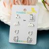Pendientes de gatito lindos de versión mini de moda coreana, pendientes de traje combinado de acero inoxidable con borde cruzado, disponibles al por mayor