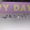 Anillo de Herradura Cruzada de Uva Transparente Hélice de Oreja Púrpura Estrella Explosiva Clavo de Oreja Pendientes Exquisitos Versátiles