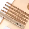 Palillos desechables envasados en película de papel kraft, palillos de madera natural carbonizada sin juntas, longitud extendida, personalizables con el nombre de la tienda en el empaque