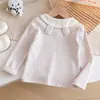 Camiseta de manga larga a rayas para niña con cuello de muñeca y diseño de oso de dibujos animados, estilo coreano, moderna, nueva prenda versátil de manga larga para primavera/otoño