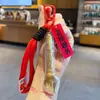 Llavero Adorno de Pluma Dorada Campeón - Regalo Inspirador para Exámenes de Ingreso a Secundaria y Universidad, Éxito Garantizado en los Exámenes