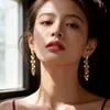 Pendientes de pentagrama de moda con incrustaciones de circonita, estilo largo, pendientes de botón con borla de estrella súper de cuento de hadas, lujo ligero, moda de alta gama, pendientes elegantes y con estilo