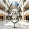 Fábrica de Origen Escultura Circular de Acero Inoxidable Superficie de Espejo Hueco Dispositivo Emisor de Luz Característica de Paisaje de Plaza Exterior Jardín