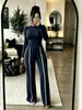723 Conjunto de dos piezas de otoño/invierno nuevo para mujer, transfronterizo europeo y americano: top liso de manga larga ajustado + pantalones de pierna ancha con rayas de contraste