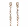 Aretes de poste plateados con diamantes y borlas de perlas, lujo ligero, alta gama, elegantes, modernos, exquisitos, aretes versátiles para mujer al por mayor