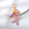 Lentejuelas de Copo de Nieve Morado Pegamento Líquido Llavero con Letra Bolsa de Mujer 26 Inglés Borla Mariposa Colgante Decoración