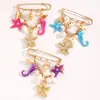 Broche de estilo de vacaciones en la playa transfronterizo europeo y americano con borlas de estrella de mar y concha para mujer, broche de moda multifuncional estilo océano
