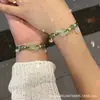 Pulsera tejida a mano estilo chino de doble corazón con amuleto de la suerte entrelazado y cascabel, Joyería versátil de lujo ligero