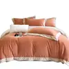 2026 nuevo juego de ropa de cama de alta gama de cuatro piezas de vellón de coral cálido de invierno, sábana y funda de edredón de franela de leche