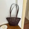 Bolsa de Mão Feminina de Nicho de Luxo 2026 Nova Moda Padrão Trançado Bolsa Cesta para Trabalho e Uso Casual Bolsa Tote