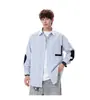 Camisa masculina de manga comprida em tecido Oxford vintage para primavera e outono, confortável e versátil para jovens.