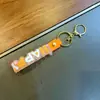Chaveiro Transparente Versátil Feliz com Pingente de Tira de Couro Pulseira de PVC Acessório de Chaveiro Acessório de Boneca Cordão