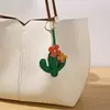 Encantos creativos de cuero con temática de planta de cactus de gran venta, accesorios para bolsos y ropa, y llaveros - al por mayor