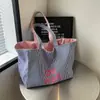 Bolsa de Lona Diseño de Nicho Ins Sentido Avanzado Gran Capacidad para Viajar al Trabajo Bolso de Hombro Estudiante Femenina Coreano Rayado Bolsa de Clase