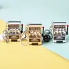 Mini Spinner Juguete Creativo Máquina de Frutas de Dibujos Animados Agitador Máquina de Lotería Juego Llavero Modelo Artificial Juguete