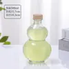 Botella Calabaza Verde Creativa en Stock Botella de Vino Ciruela Botella para Bebidas de Té Celebridad de Internet Botella Transparente para Vino de Frutas Vino Sellado con Tapa