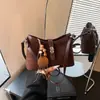 Bolso de mano de diseño nicho de alta gama transfronterizo para mujer, nueva colección otoño 2026, bolso de hombro versátil de estilo coreano retro simple
