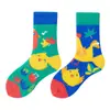 Calcetines originales de moda infantil AB color asimétrico dibujos animados longitud media otoño e invierno caramelos lindos calcetines de algodón para niños y niñas
