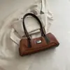 Bolso de Hombro Retro de Nicho Francés para Mujer 2026 Otoño Nuevo Bolso de Bowling Simple de Moda Portátil para el Viaje Diario