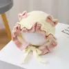 Gorro de otoño e invierno dulce con lazo y orejeras, estilo tejido de pequeña princesa, moderno y cálido para niñas pequeñas, proporcionando protección contra el viento y el frío
