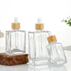 Botella dispensadora de aceite esencial de vidrio transparente, gotero de punta de plástico portátil, empaque de producto para el cuidado de la piel, botella vacía, botella de perfume portátil para viajes