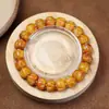 Pulsera Wen play talla en hueso de yak pulsera de semillas de pasión accesorios de Tianzhu del Tíbet imitación Qiu Jiao Huang Caishen joyería al por mayor