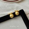 Pendientes redondos dorados con diseño de nicho único para mujer, otoño e invierno 2024, nuevos pendientes de lujo ligeros y explosivos de alta gama.