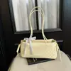 Bolsa de ombro feminina estilo coreano com bolinhas doces para axila, novo modelo 2026, bolsa de ombro nicho delicada com laço, bolsa de mão para o dia a dia