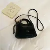 Bolso de mano casual simple de nicho estilo coreano, bolso tote pequeño para mujer, nuevo bolso de moda 2026 para ir al trabajo, al hombro y cruzado