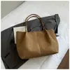 Novo modelo outono de 2026 bolsa de ombro simples, grande capacidade, moderna, cor sólida, estilo coreano, textura, bolsa tote casual tendência para Instagram