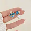 Pendientes de esmalte de goteo asimétricos de lujo ligero de nicho, moda versátil, pendientes de flor de alta gama, pendientes al por mayor