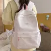 Mochila de nuevo estilo para niñas, estilo coreano, alto atractivo estético, diseño inspirado en la universidad, estampado de estrellas, ligera y casual, adecuada para estudiantes de secundaria y preparatoria.