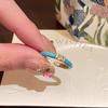 Anillo de apertura con flor de circón y gotas de aceite azul esmaltado para mujer, ligero, de lujo, con diseño de nicho superpuesto de alto nivel.