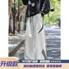 Pantalones largos de marca de moda estilo americano de corte holgado, pantalones deportivos casuales de pierna ancha, pantalones de chándal a rayas de alta resistencia para hombre, diseño deconstruido de otoño