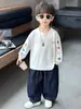 Camiseta de manga larga estampada para niños, primavera y otoño, estilo coreano, diseño de bloques de color, top casual para niños pequeños y niños, calidad de exportación