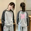 Roupa de baixo feminina com forro de fleece, novo estilo outono/inverno 2026, roupa íntima quente para estudantes, blusa de manga comprida com gola redonda para meninas, disponível nos tamanhos M e G