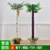 Planta de ratán con flores artificiales de bambú, bolsa de corteza de plástico, tubo de calefacción, protección de gas, pilar, tubería de alcantarillado, decoración