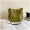 Bolso Grande Tejido Hueco Transfronterizo para Mujer 2026 Nuevo Estilo Bolso Cubo de Cuero Suave Simple Bolso Cruzado de Gama Alta de Verano