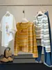 Conjunto de dos piezas para mujer: cárdigan de punto a rayas de manga larga estilo coreano + camisola, nuevo top casual ajustado para primavera y otoño